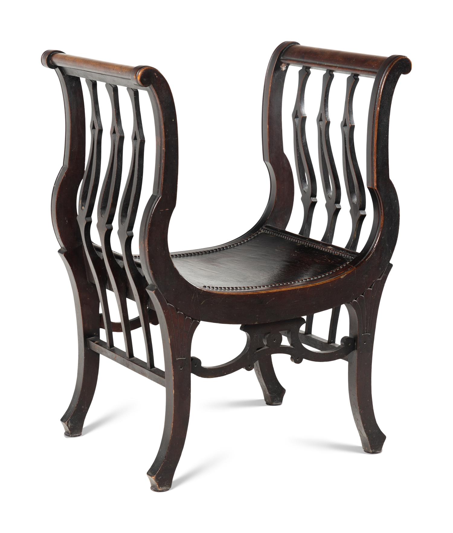 An American Victorian Carved Curule Chair