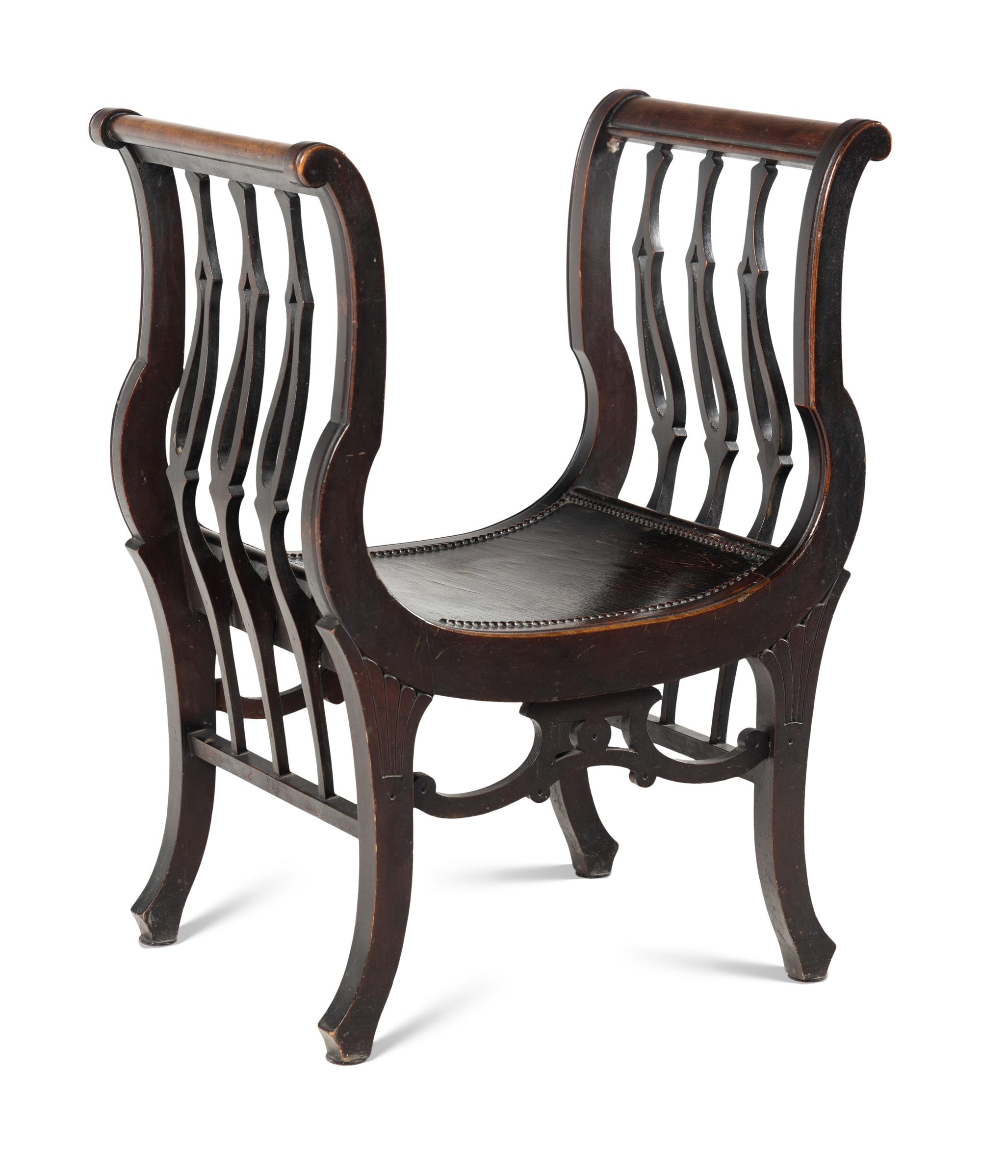 An American Victorian Carved Curule Chair
