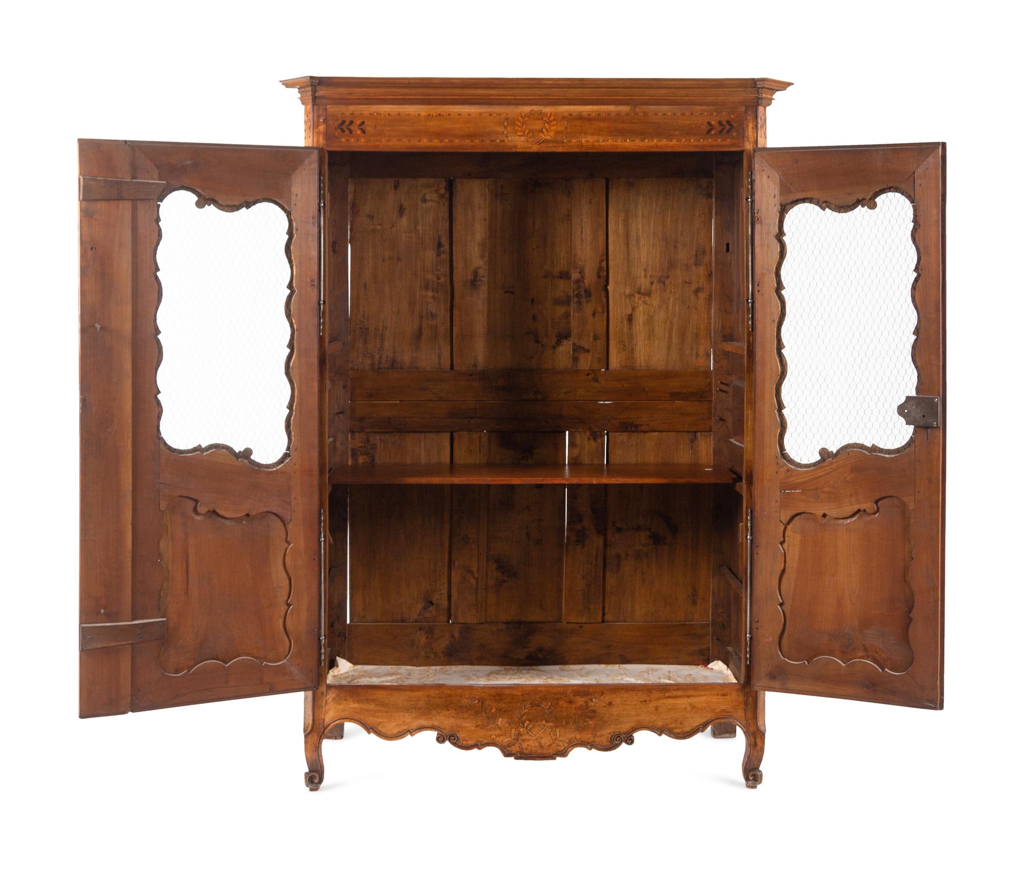 A French Provincial Walnut Armoire