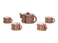 A Chinese Yixing Zisha Pottery Teapot and Four Teacups
