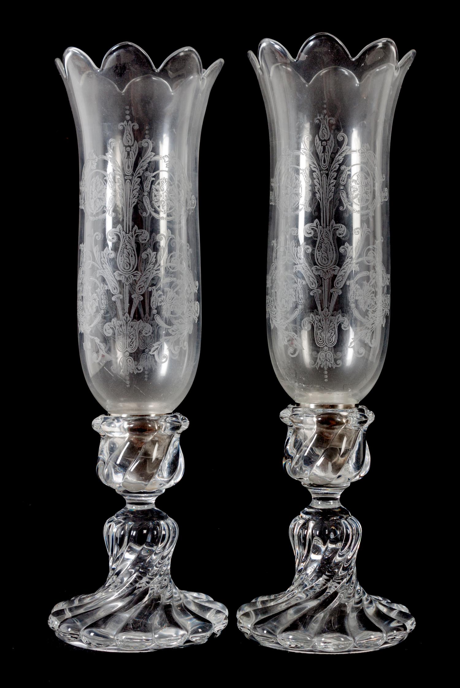 A Pair of Swirled Molded Glass Candlesticks with Hurricane Shades Height 16 inches. — 20TH CENTURY