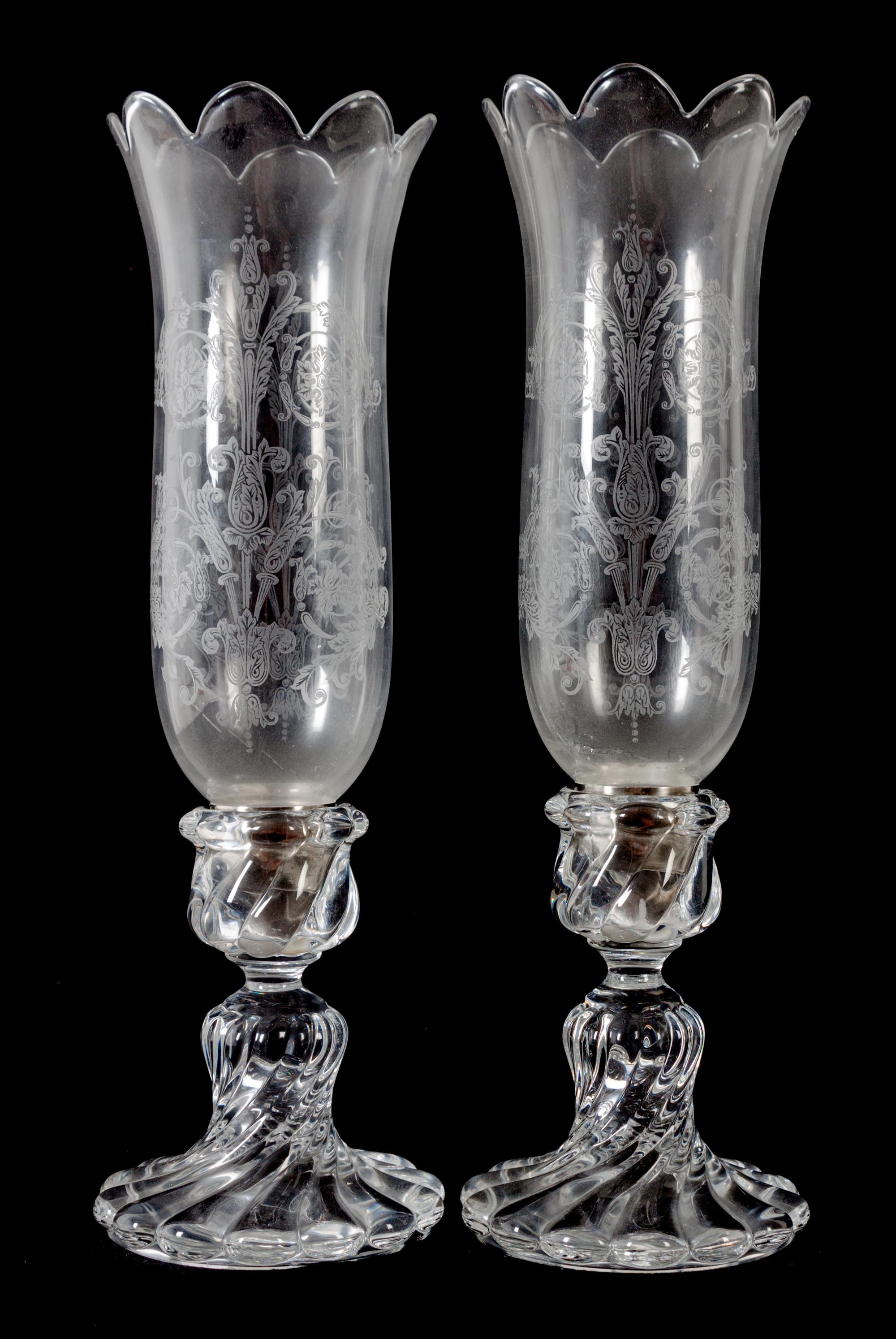 A Pair of Swirled Molded Glass Candlesticks with Hurricane Shades Height 16 inches. — 20TH CENTURY