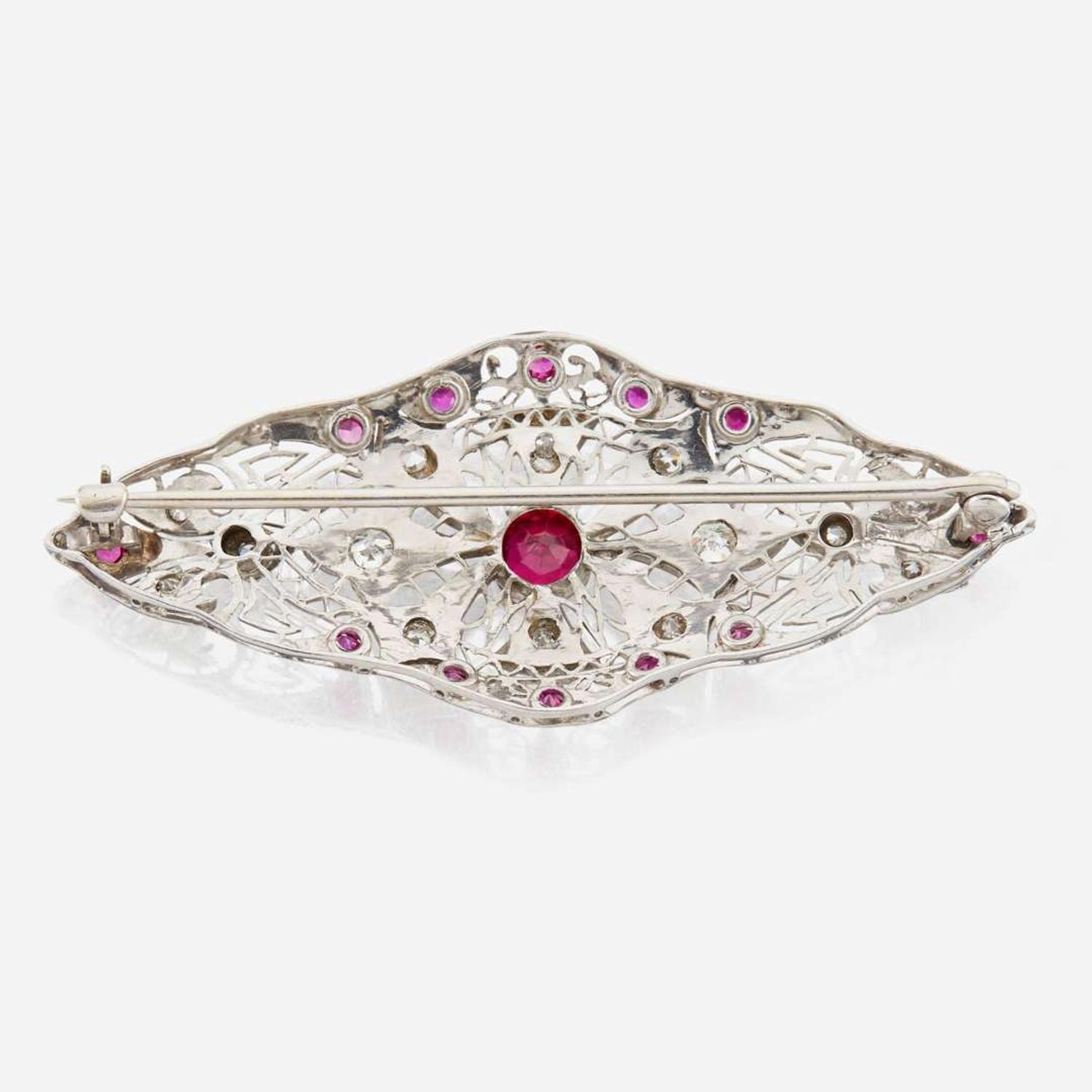 A platinum, diamond, and ruby brooch