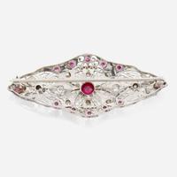 A platinum, diamond, and ruby brooch