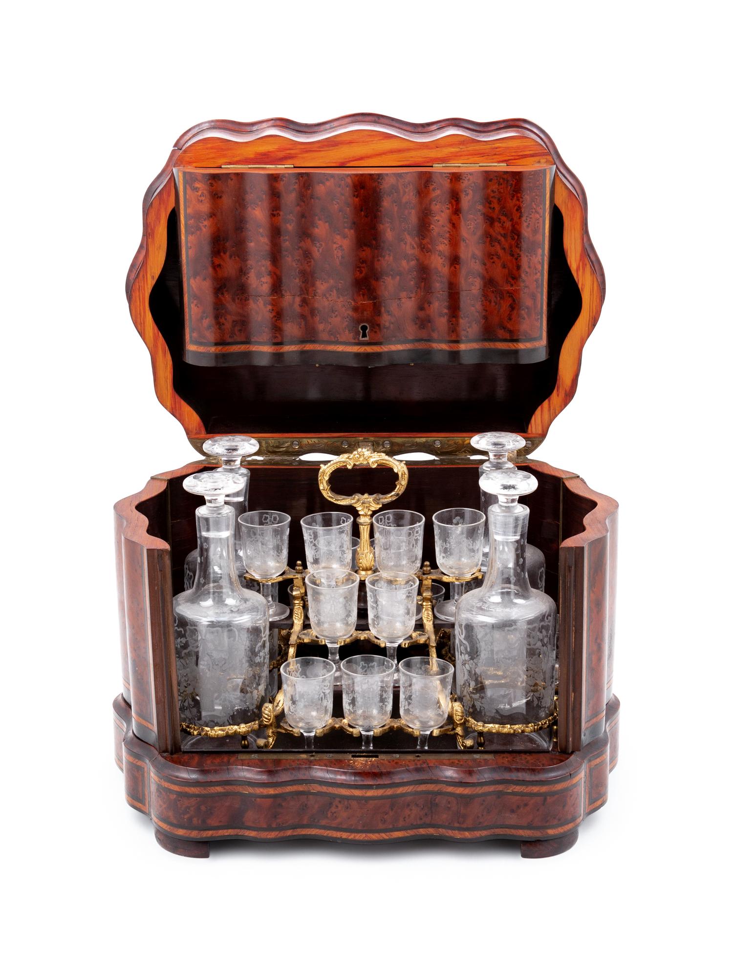 A Napoleon III Parcel Ebonized Amboyna Cave à Liqueur