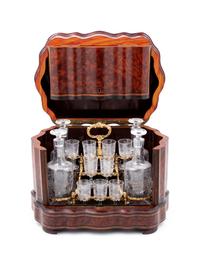 A Napoleon III Parcel Ebonized Amboyna Cave à Liqueur