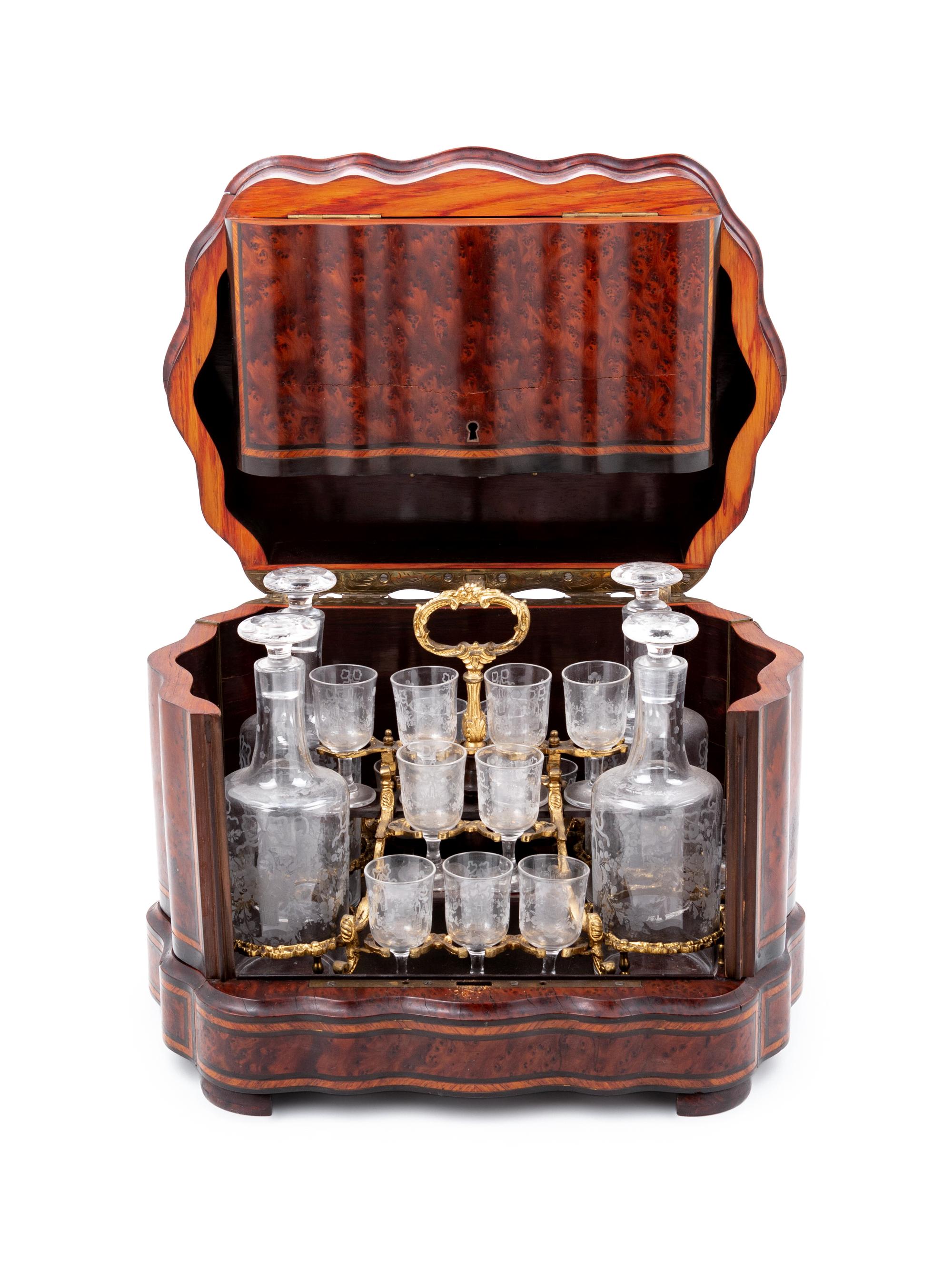 A Napoleon III Parcel Ebonized Amboyna Cave à Liqueur