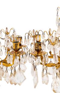 A Pair of Régence Style Rock Crystal, Cut Glass and Engraved Gilt Bronze Six-Light Candelabra on Simulated Porphyry Bases