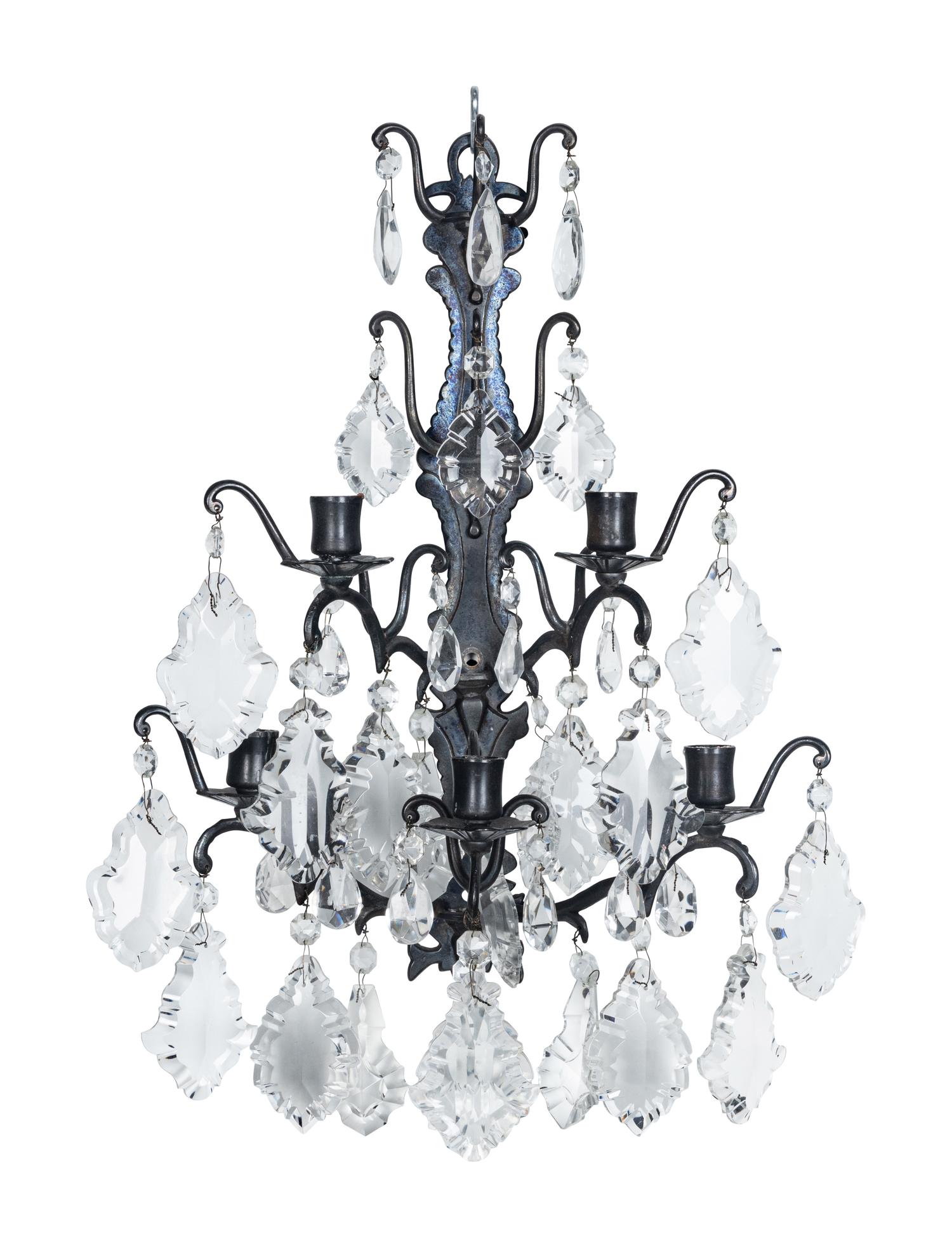 A Set of Four Iron and Glass Five-Light Sconces