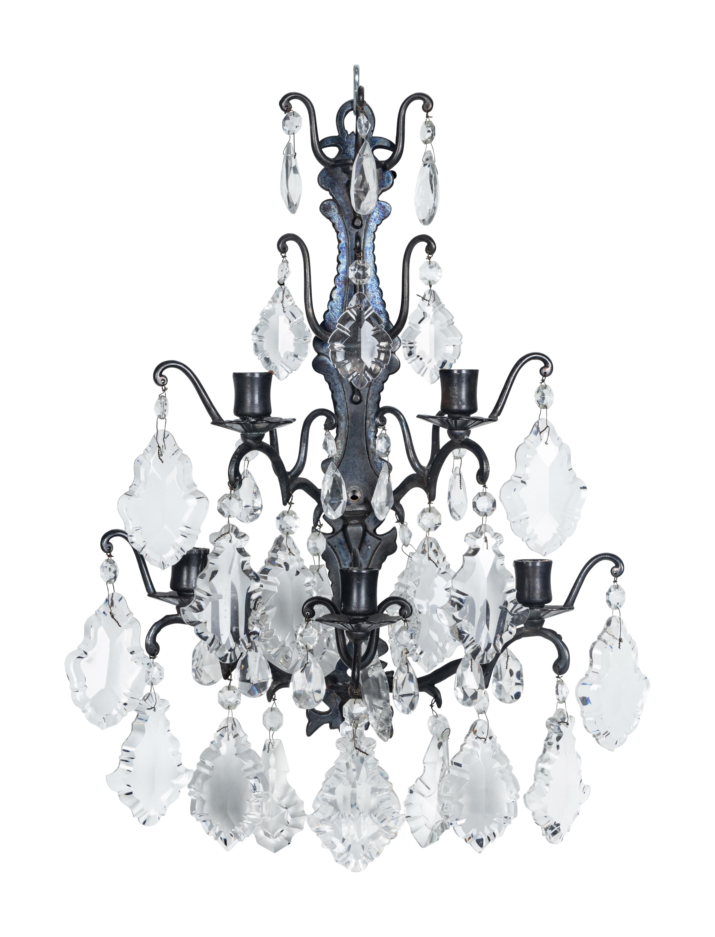 A Set of Four Iron and Glass Five-Light Sconces