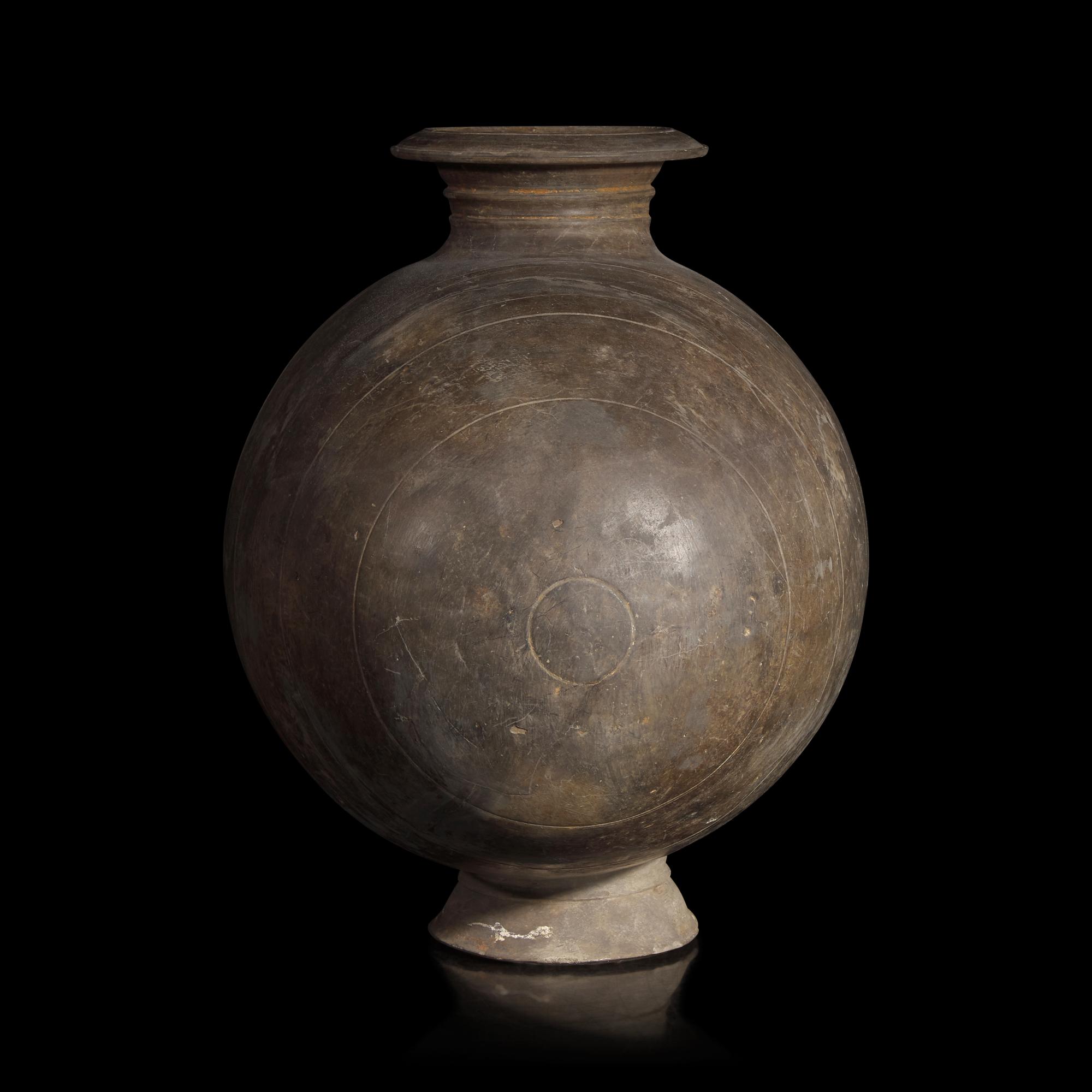 A Chinese Grey Pottery Cocoon Jar, Han Dynasty — 漢 灰陶繭形罐