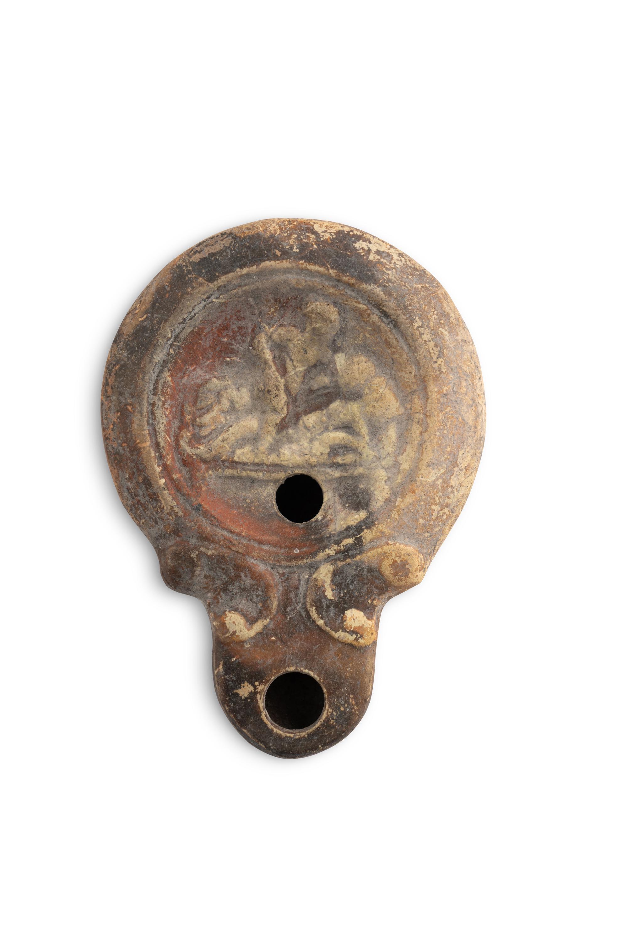 A Group of Seventeen Roman Oil Lamps and Lamp Handles
