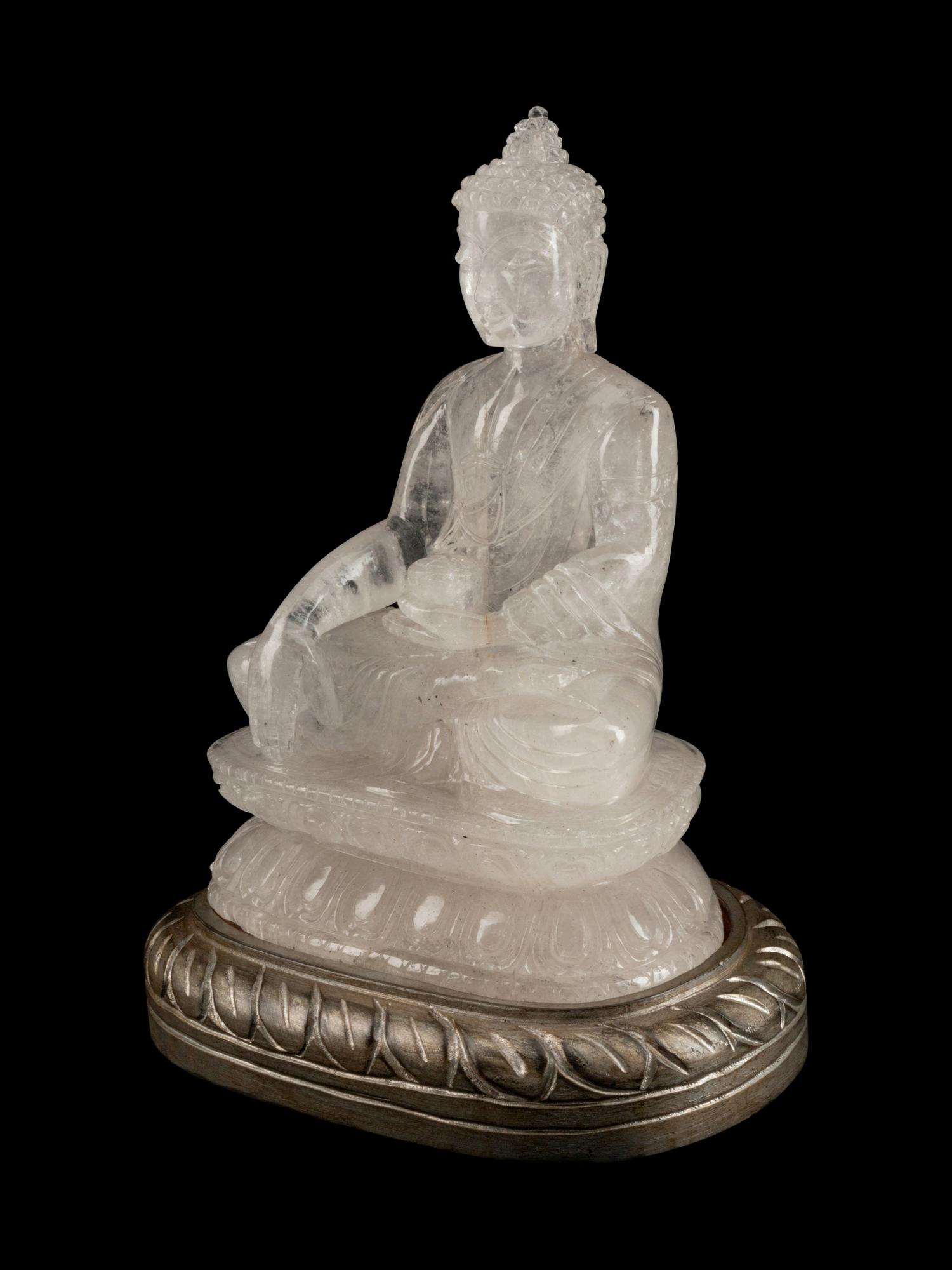 A Chinese Carved Rock Crystal Figure of Buddha