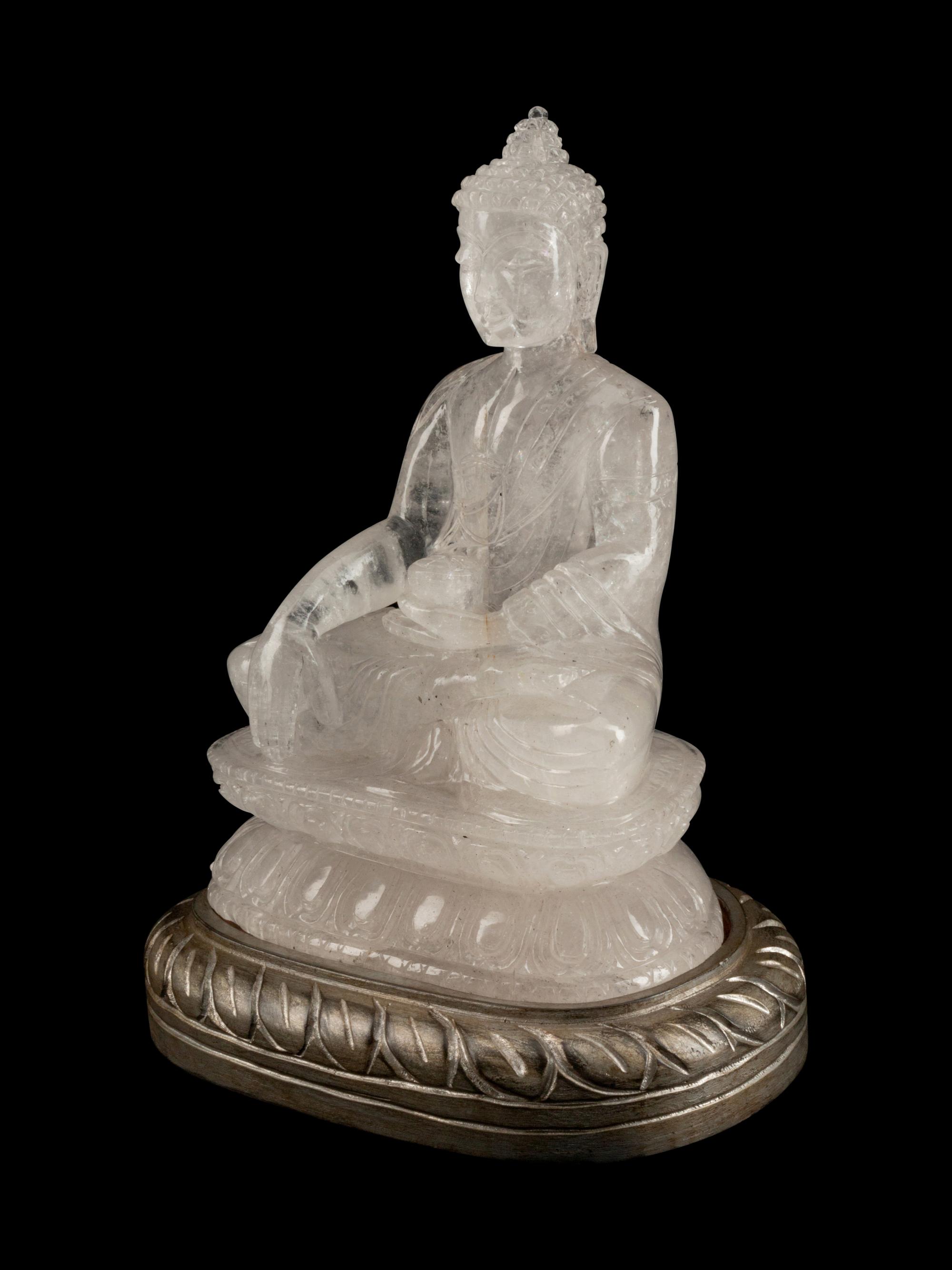 A Chinese Carved Rock Crystal Figure of Buddha
