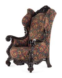 A Karpen Carved Mahogany Wingback Armchair