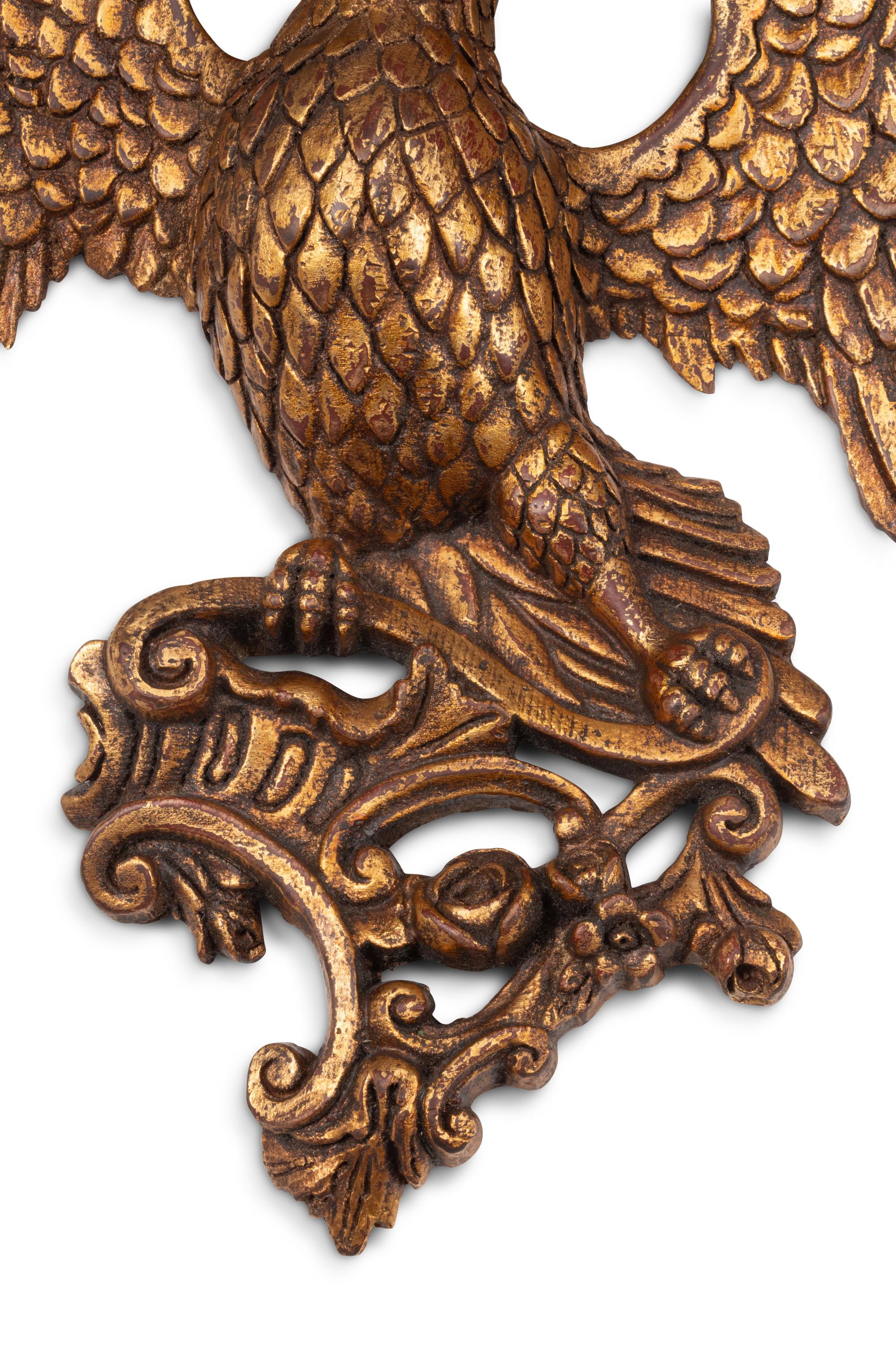 A Set of Four Italian Carved Giltwood Eagle Brackets