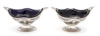 A Pair of English Silver Oval Footed Baskets, Charles Stuart Harris, London, 1896, of boat form with reticulated decoration overall, wi