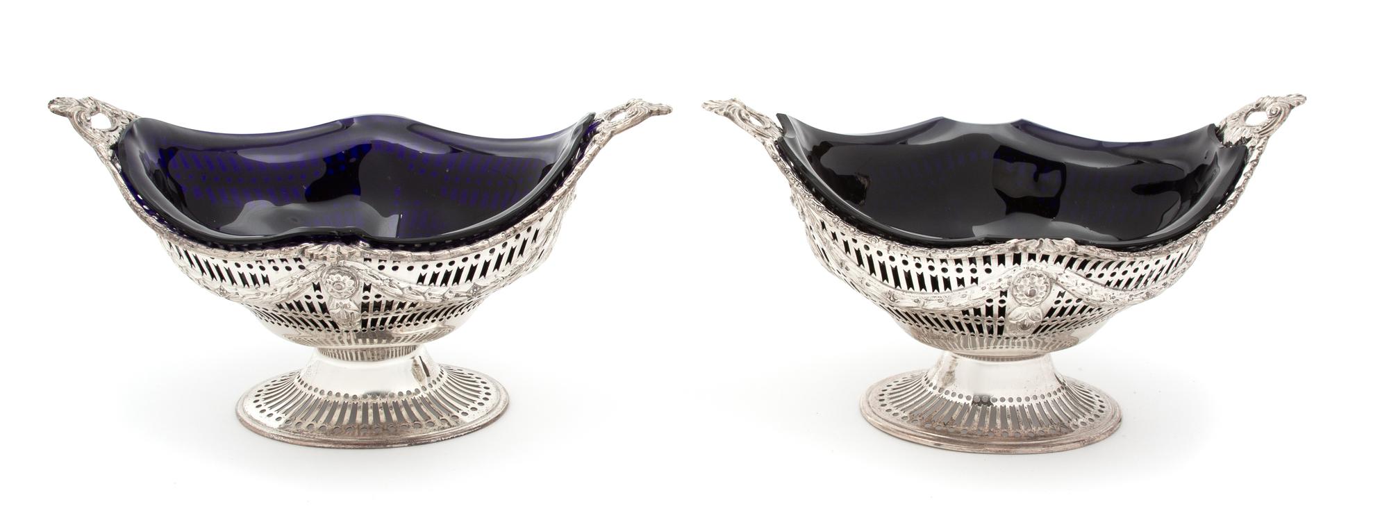 A Pair of English Silver Oval Footed Baskets, Charles Stuart Harris, London, 1896, of boat form with reticulated decoration overall, wi