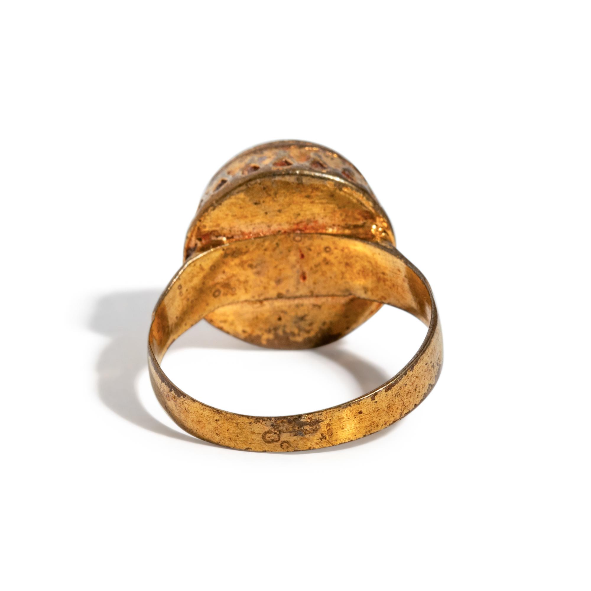 A Near Eastern Banded Agate Cabochon — Set in a gold ring