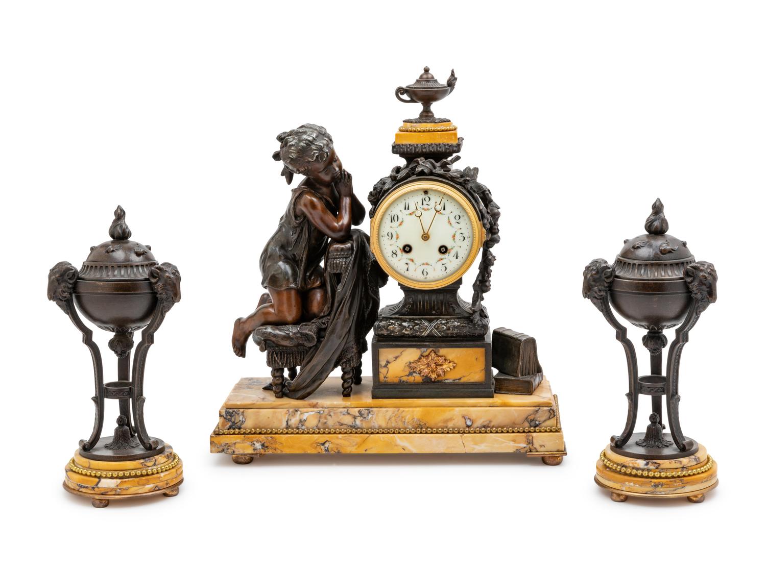 A French Patinated Metal and Marble Three-Piece Clock Garniture