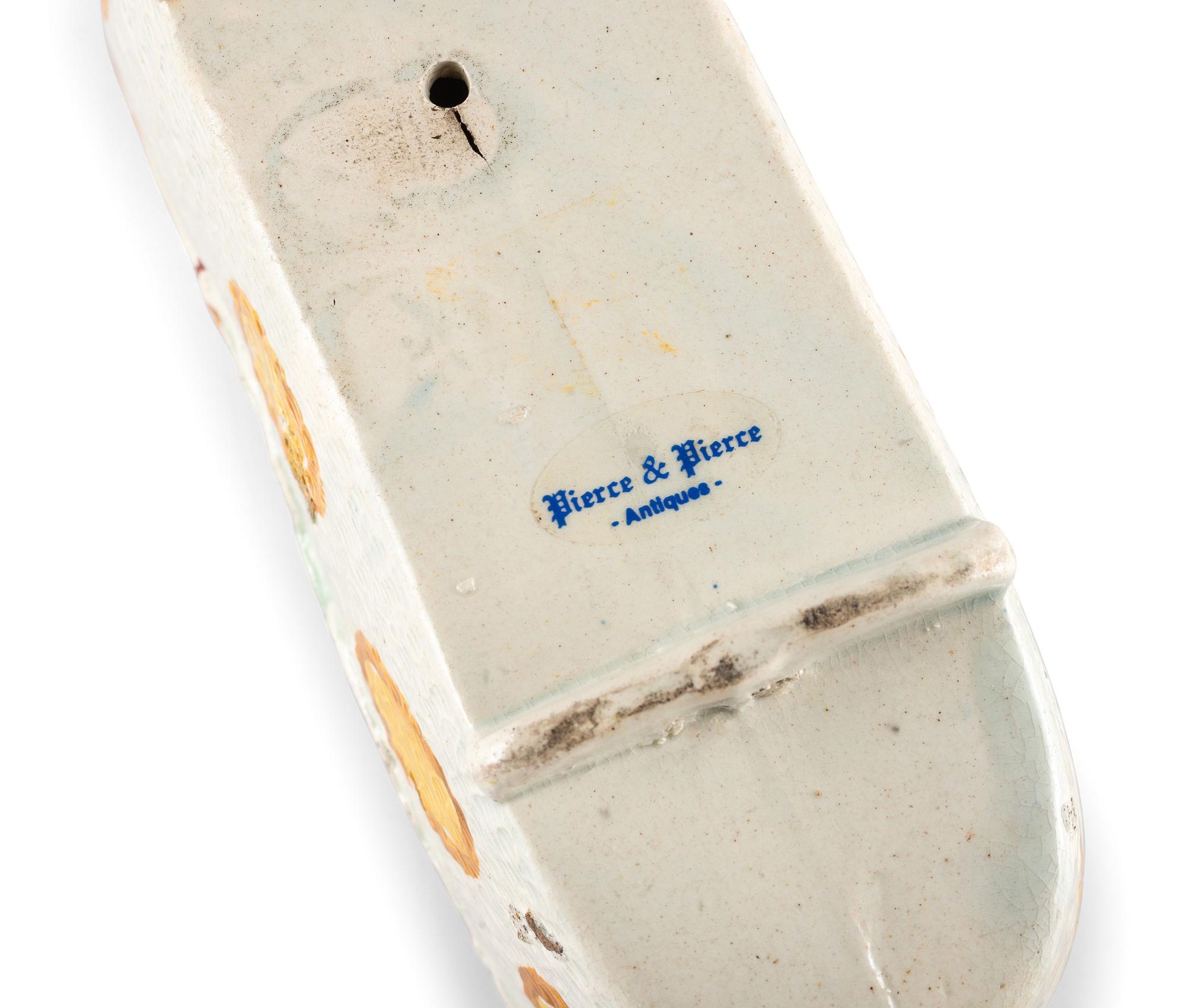 A Staffordshire Pearlware Figure of a Child in a Cradle