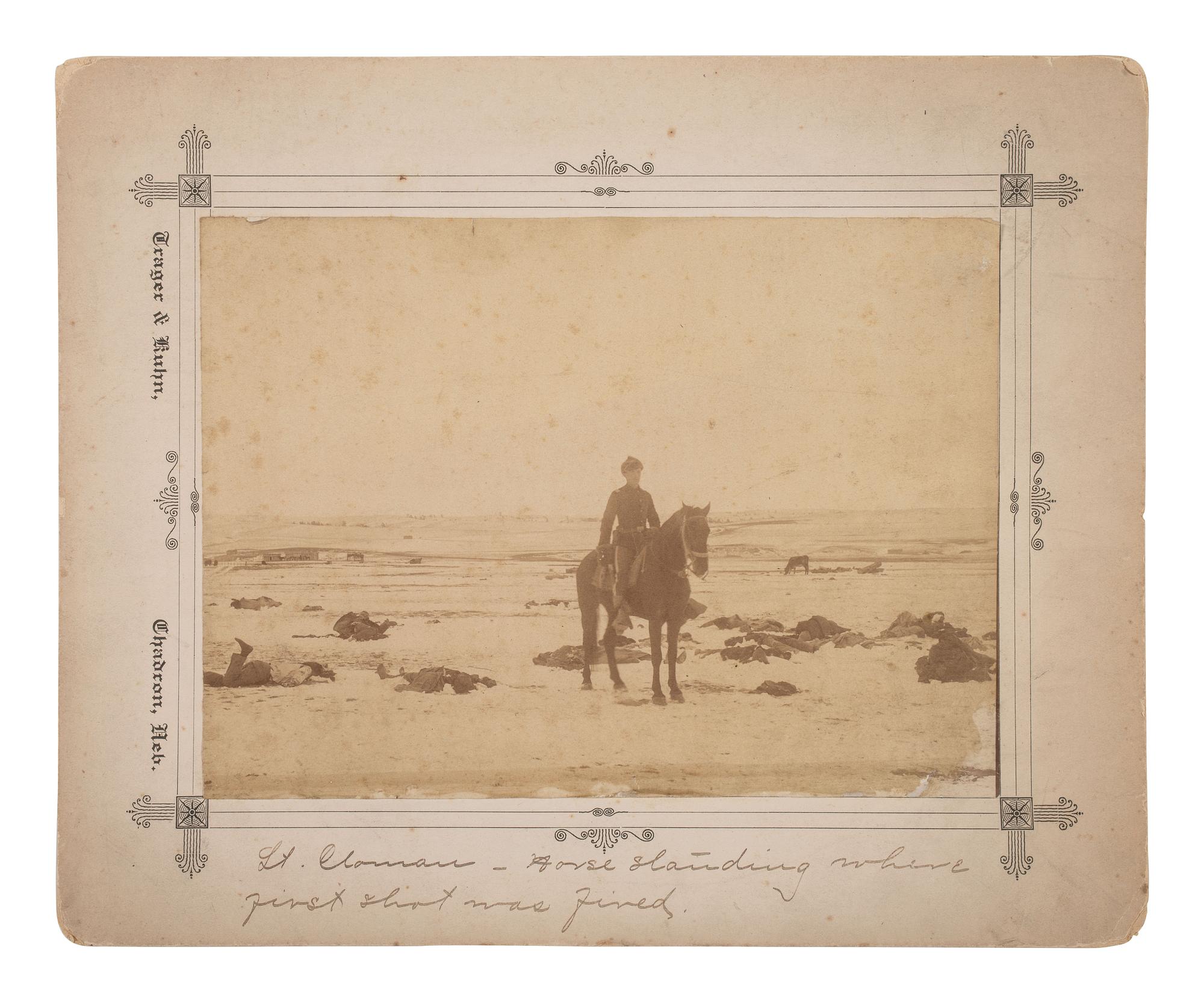 [WOUNDED KNEE]. Four photographs taken in the immediate aftermath of Wounded Knee, incl. Lt. Sydney Cloman on the battlefield surrounded by dead Lakota members of Big Foot’s Band. January 1891.