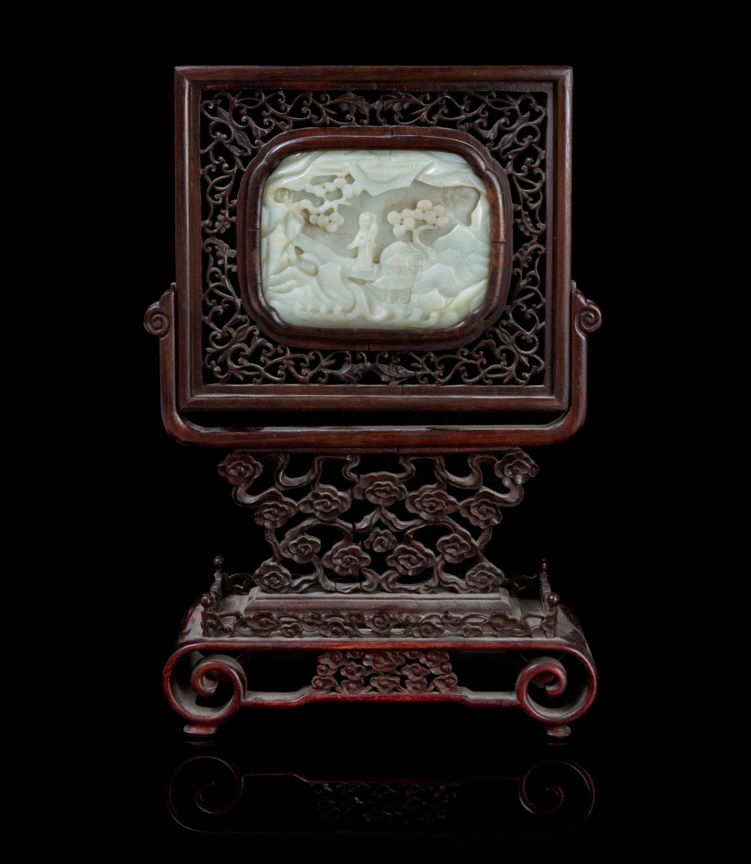 A Carved Jade Plaque Height of stone 3 1/4 x width 4 1/4 inches.