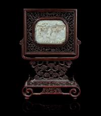A Carved Jade Plaque Height of stone 3 1/4 x width 4 1/4 inches.