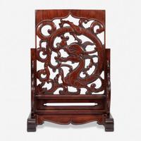 A Chinese carved and pierced huanghuali "dragon" panel, in later hardwood stand 黄花梨镂雕龙纹木板 后配底座 The panel late Ming/Qing dynasty ??????