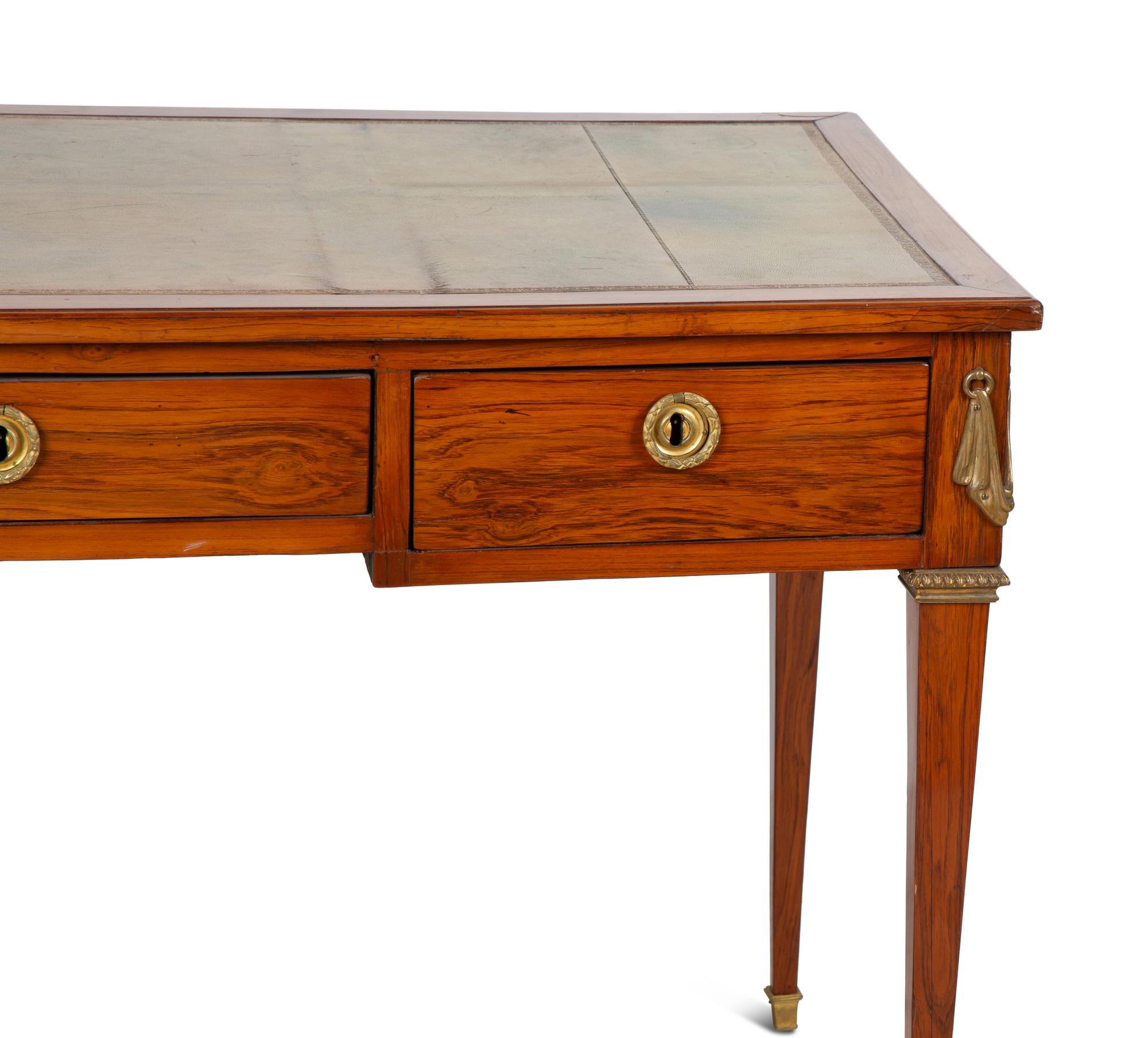 A French Gilt Bronze Mounted Mahogany Bureau Plat