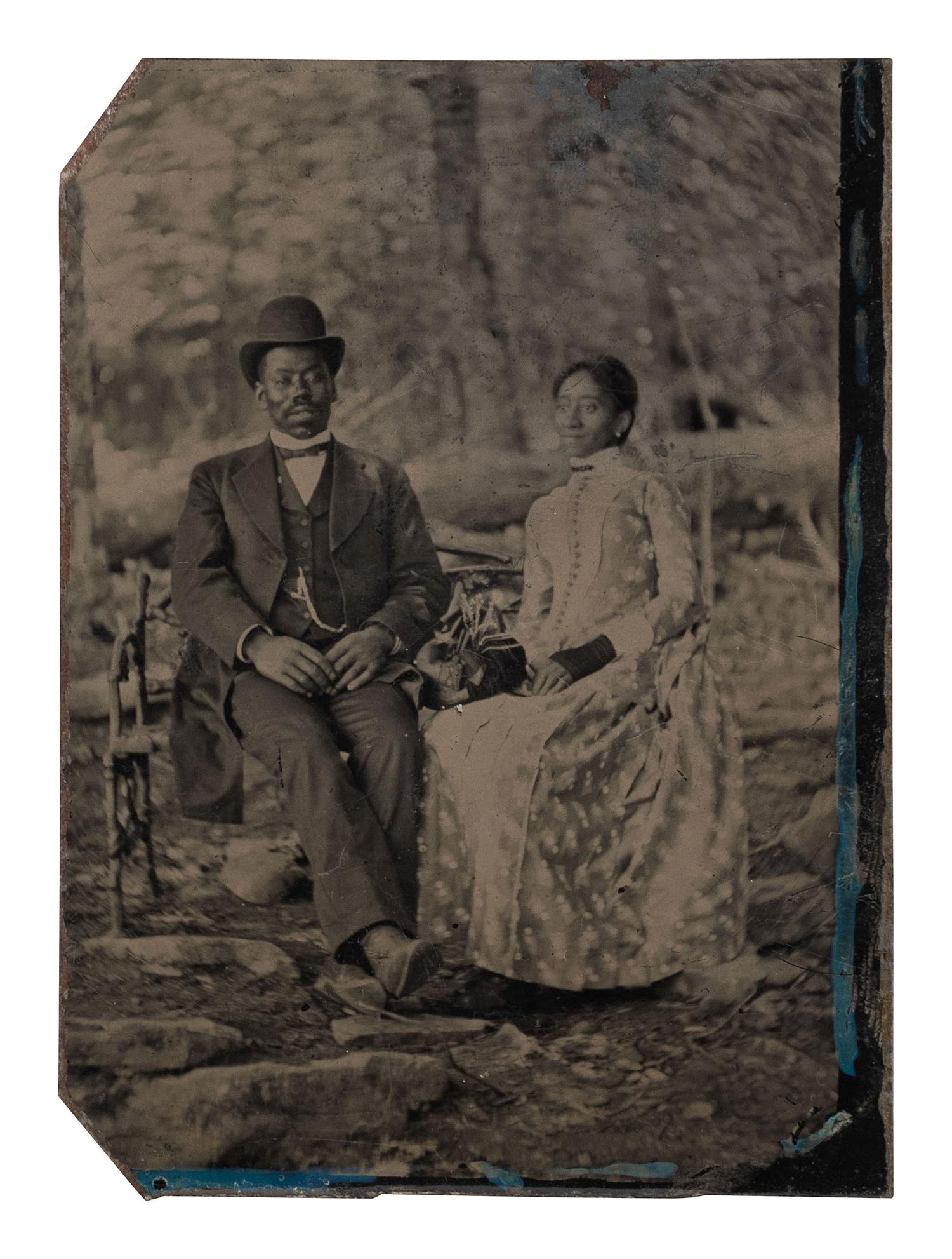 [EARLY PHOTOGRAPHY]. Tintype of an African American couple in an outdoor setting.