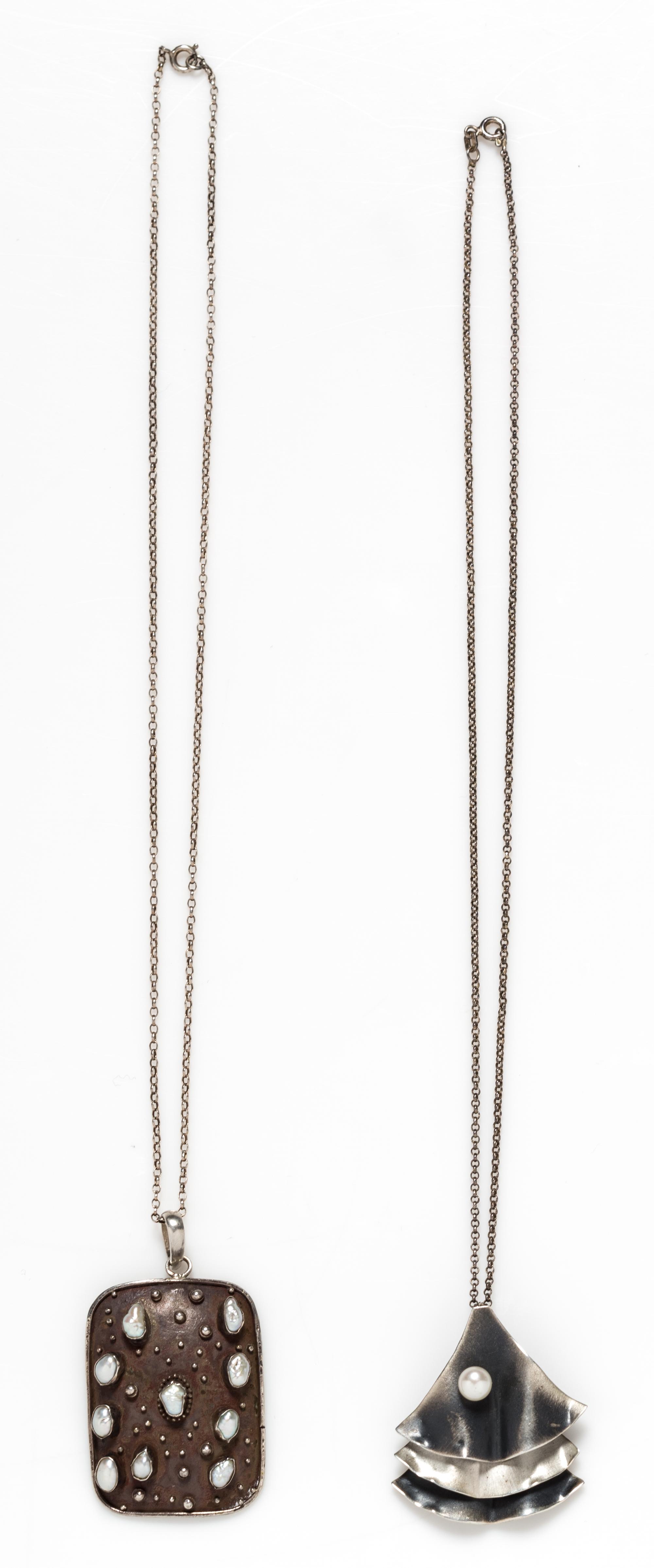 A Collection of Silver and Cultured Pearl Pendants, 13.20 dwts.