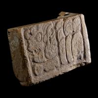 A Maya Limestone Panel with Glyphs