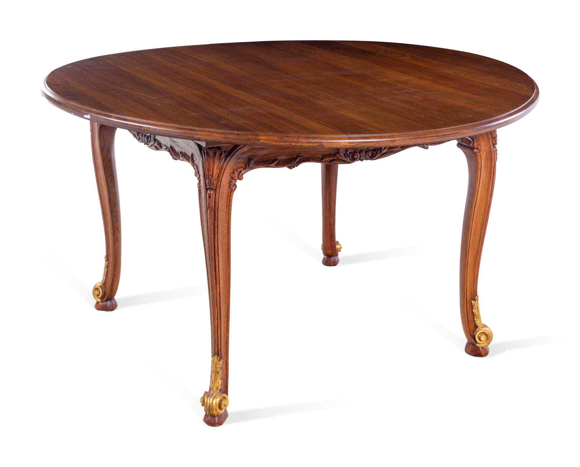 A Louis XV Style Parcel Gilt Walnut Center Table