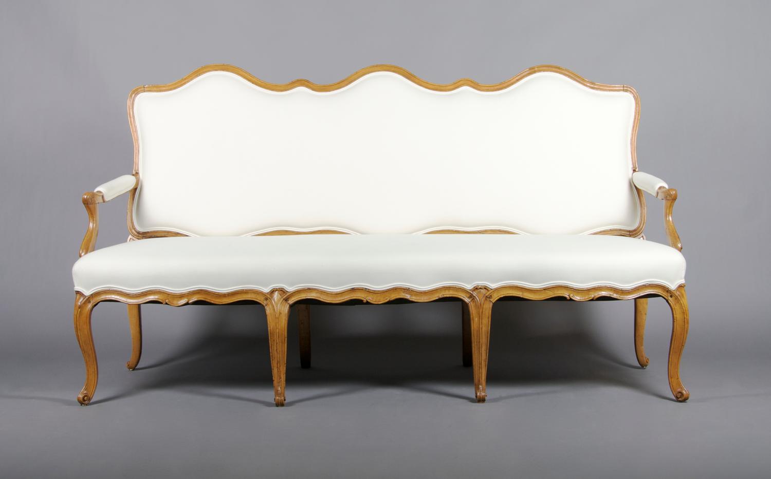 A French Provincial Fruit Wood Settee, Height 43 x width 77 x depth 26 inches.