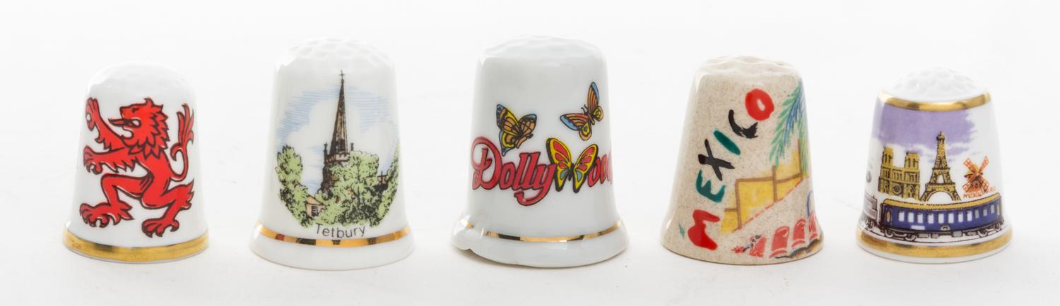 A Collection of Five Souvenir Thimbles Height 1 1/8 inches.