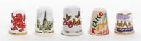 A Collection of Five Souvenir Thimbles Height 1 1/8 inches.