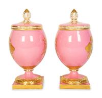 A Pair of English or Continental Porcelain Pink-Glazed Urns