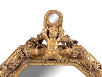 An Italian Baroque Style Giltwood Mirror