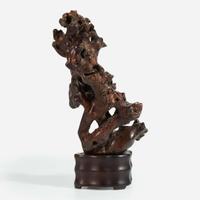 A Chinese rootwood "scholars stone" on wood stand