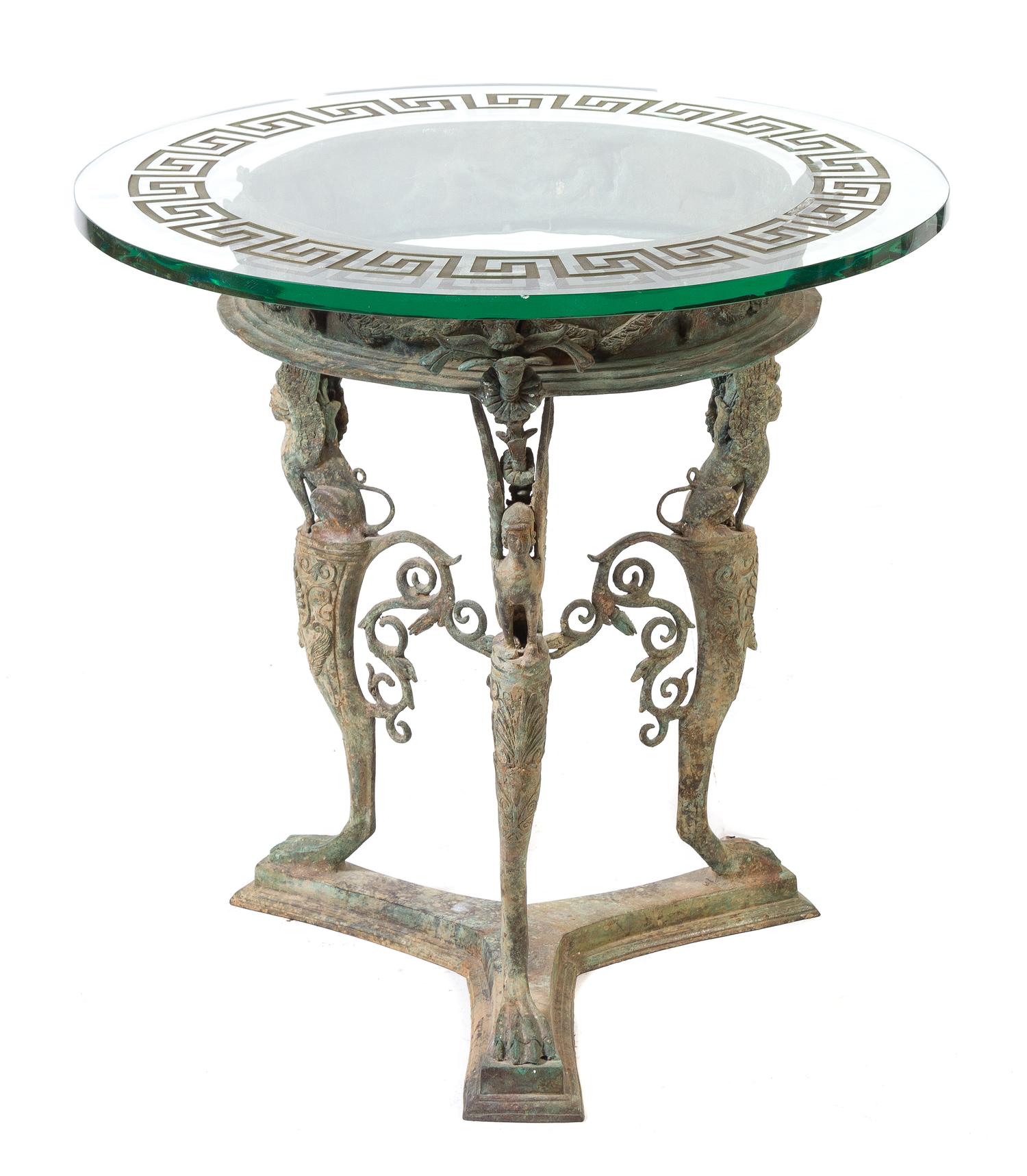 A Pompeiian Style Patinated Bronze Table Height 29 x diameter of top 30 inches. — 20TH CENTURY