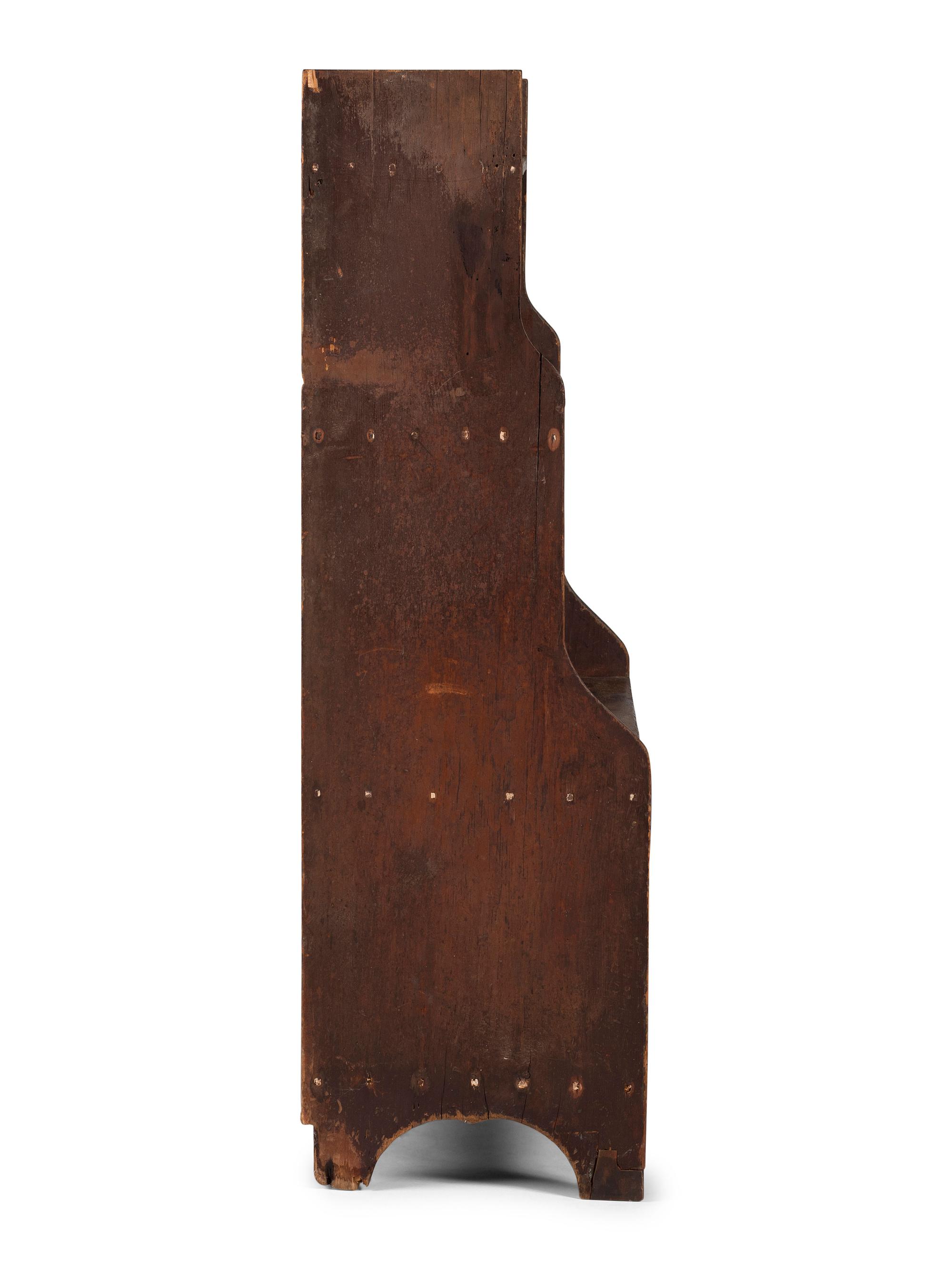 A Country Reddish-Brown Painted Pine Four-Tier Bucket Shelf