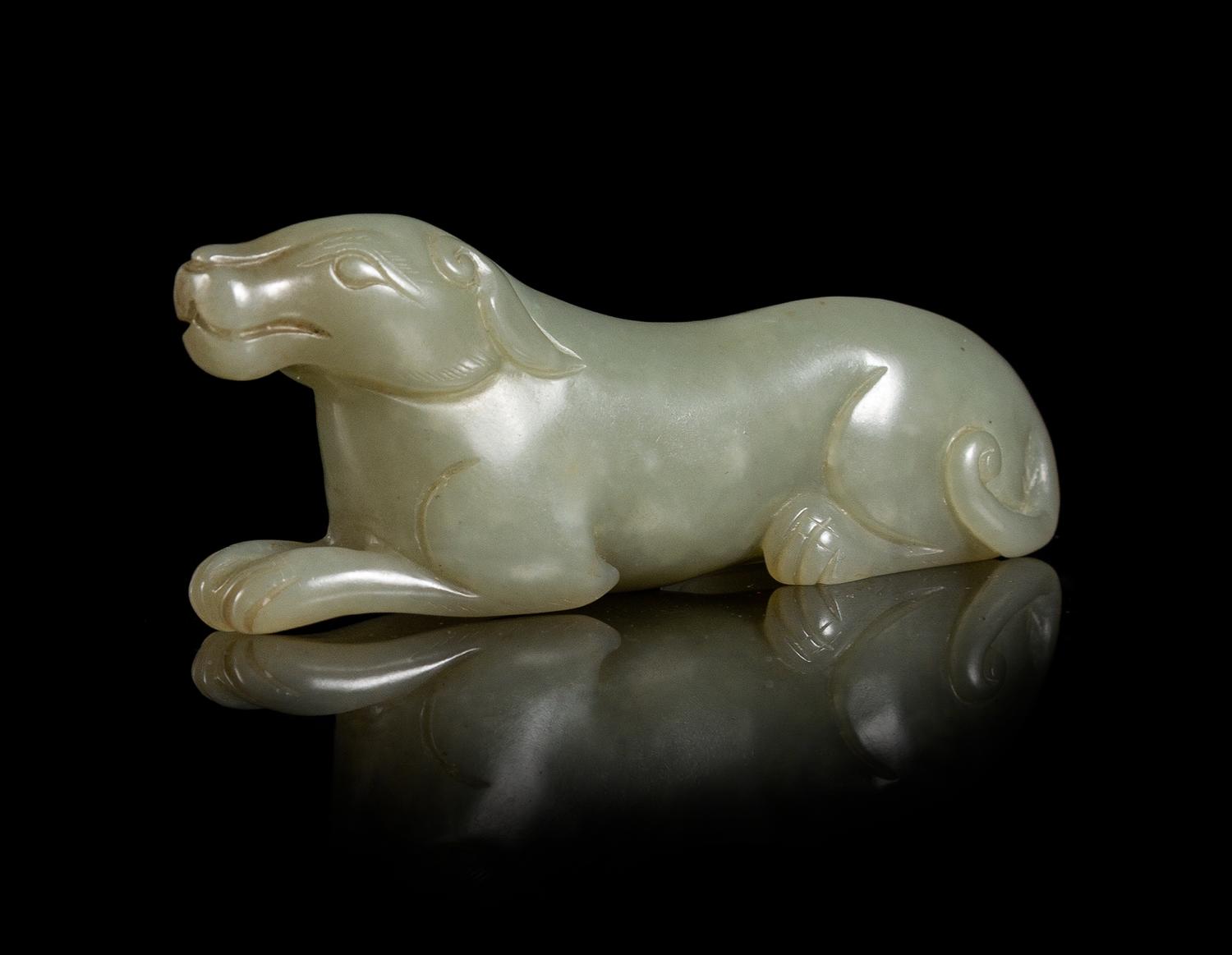 A Carved Celadon Jade Figure of a Hound Length 3 inches.