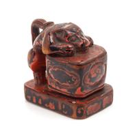 A Japanese Lacquered Wood Netsuke Height 1 1/4 inches.
