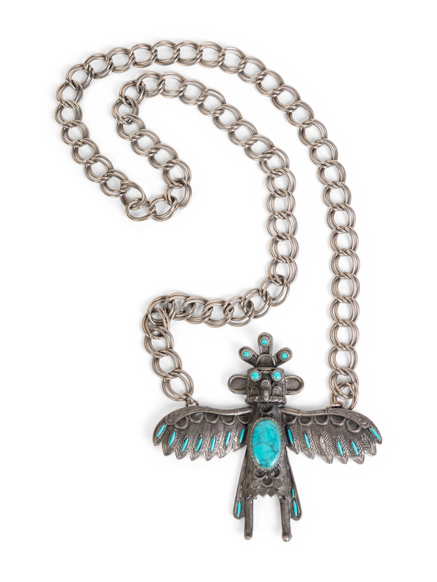 A Silver and Turquoise Pendant