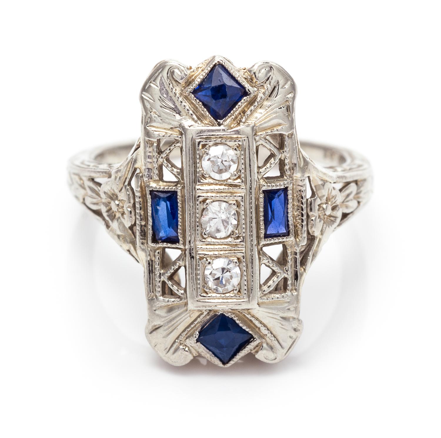 An 18 Karat White Gold, Diamond and Synthetic Sapphire Ring, 2.20 dwts.