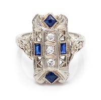 An 18 Karat White Gold, Diamond and Synthetic Sapphire Ring, 2.20 dwts.