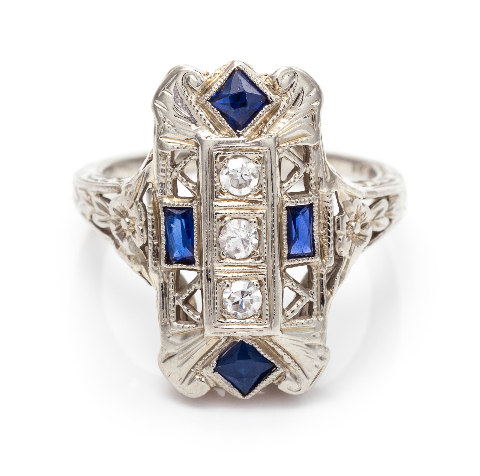 An 18 Karat White Gold, Diamond and Synthetic Sapphire Ring, 2.20 dwts.