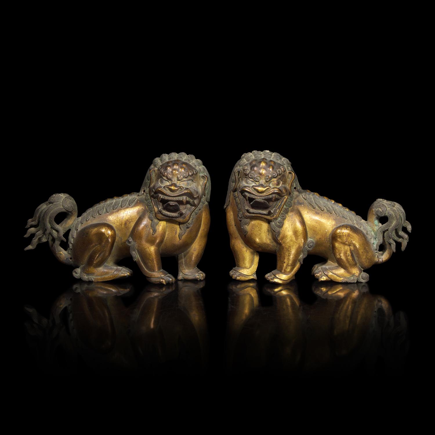 A Pair of Chinese Gilt Bronze Lion Mounts, 17th/18th Century 清中期 鎏金銅獅一對
