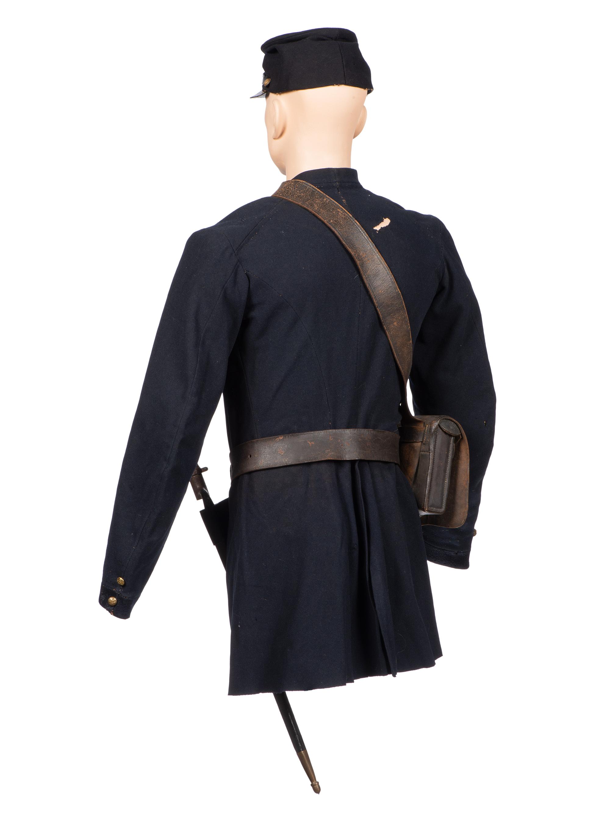 [CIVIL WAR]. A collection of items attributed to Thomas W. Johnson, Co. K, 4th Delaware Infantry, incl. frock coat, cap, belt rig, and cartridge box.